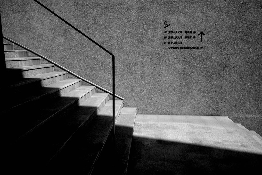 Stairs, handrail, and directions.