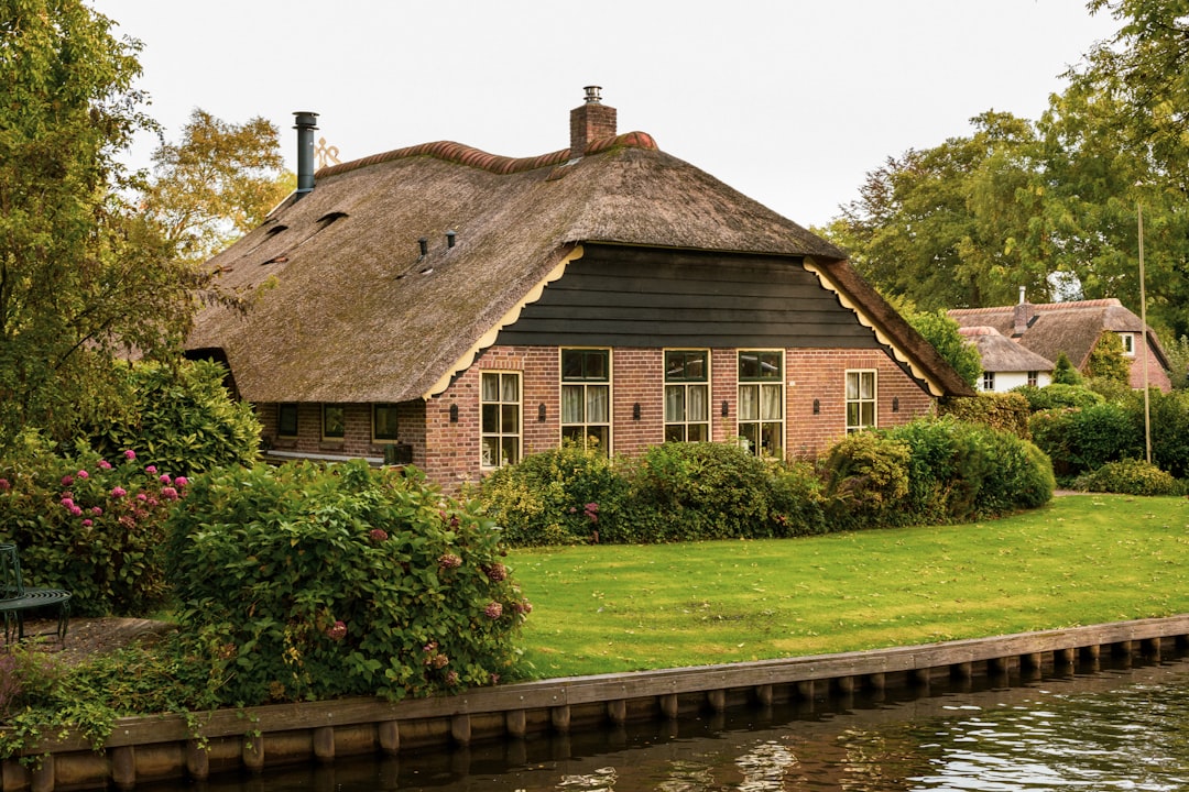 a house with a pond in front of it