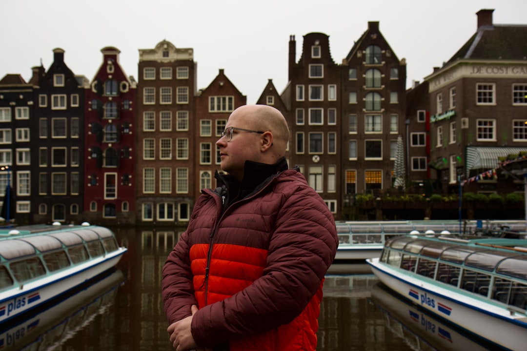A man standing in front of a body of water